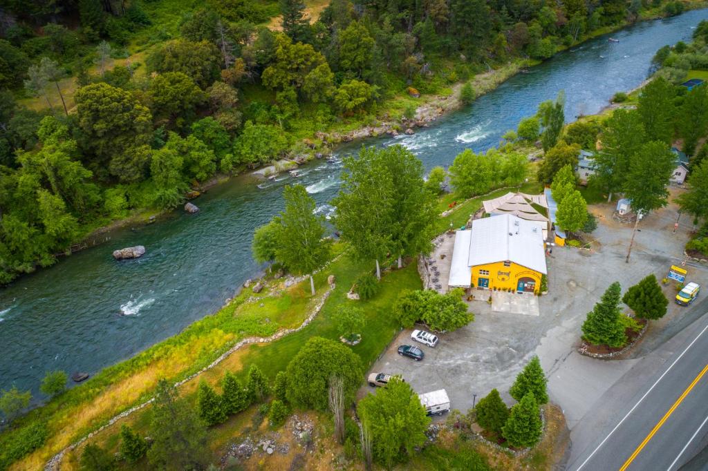 an aerial view of a church next to a river at Strawhouse Resorts in Big Bar