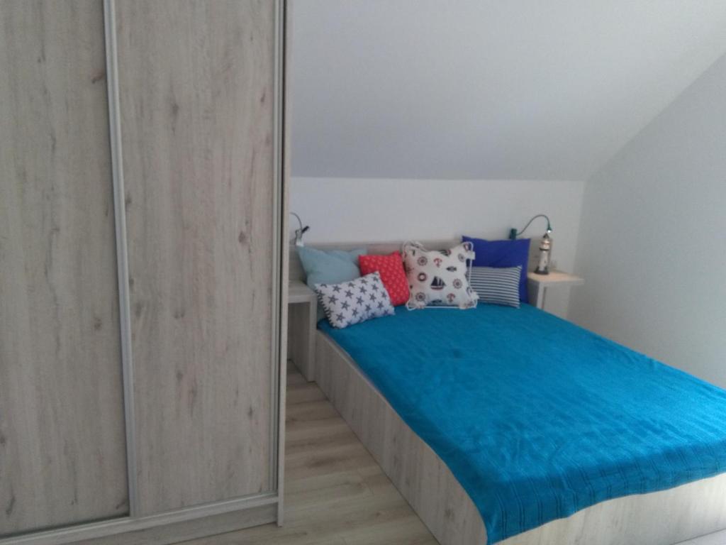 Postel nebo postele na pokoji v ubytování Domki Ancora - komfortowe domki nad morzem