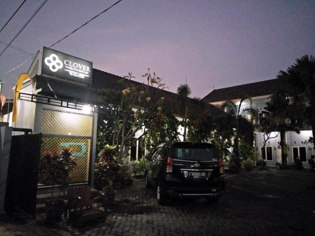 a car parked in front of a building at night at Clover Homestay in Probolinggo