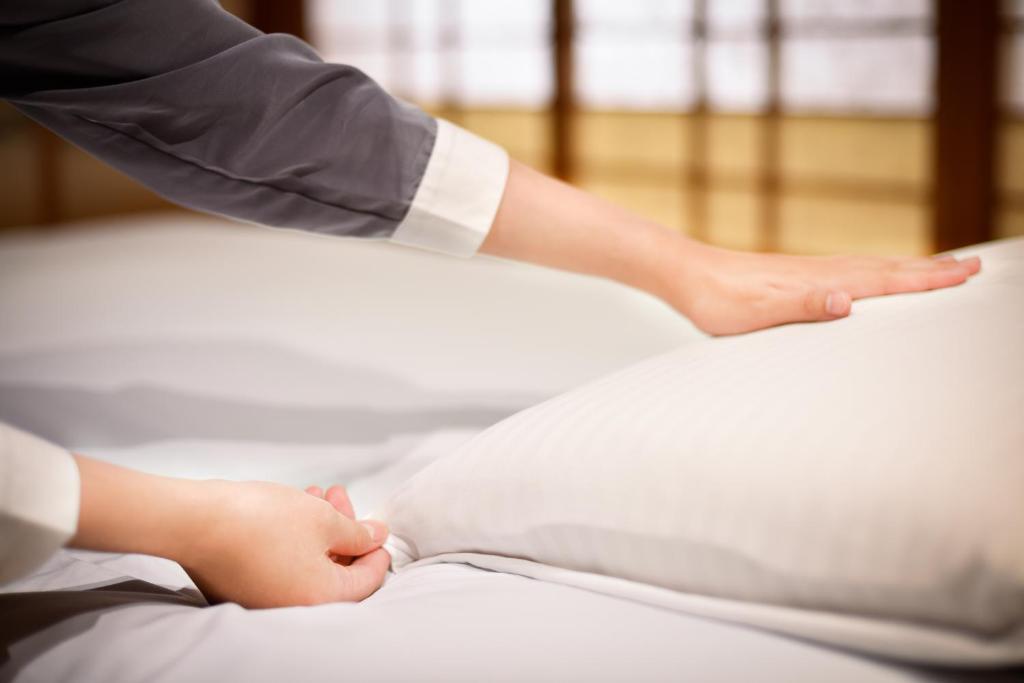 Postel nebo postele na pokoji v ubytování Hotel Tainan