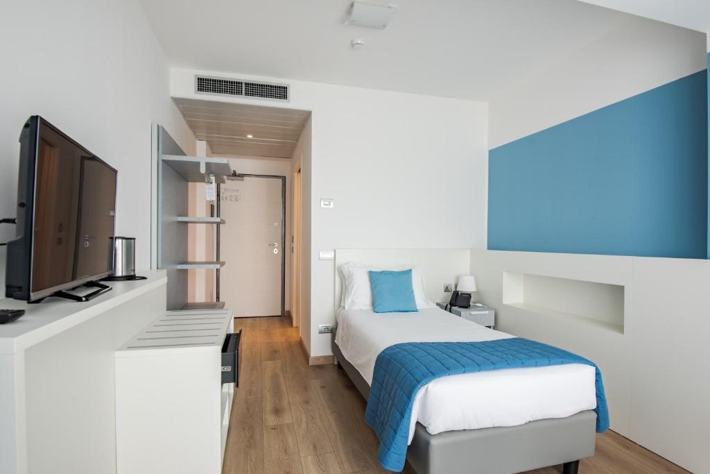Postel nebo postele na pokoji v ubytování Hotel Vischi
