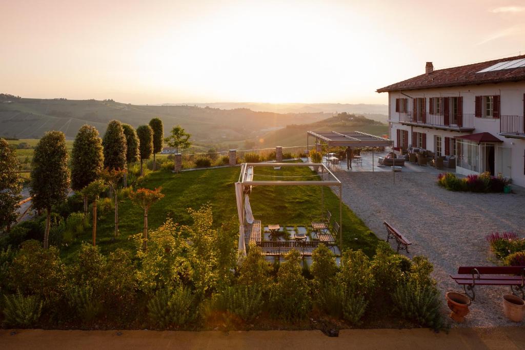 arial view of a garden with a house and a building at Cascina Alberta in Treiso