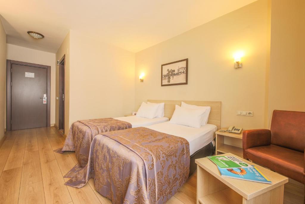 Postel nebo postele na pokoji v ubytování Hostapark Hotel
