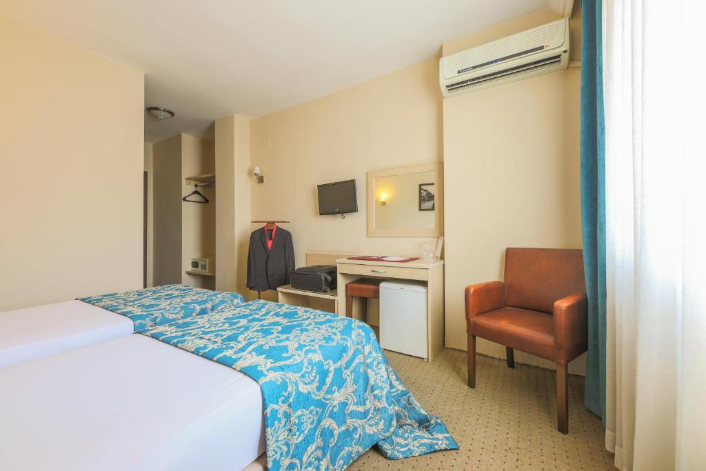 Postel nebo postele na pokoji v ubytování Hostapark Hotel