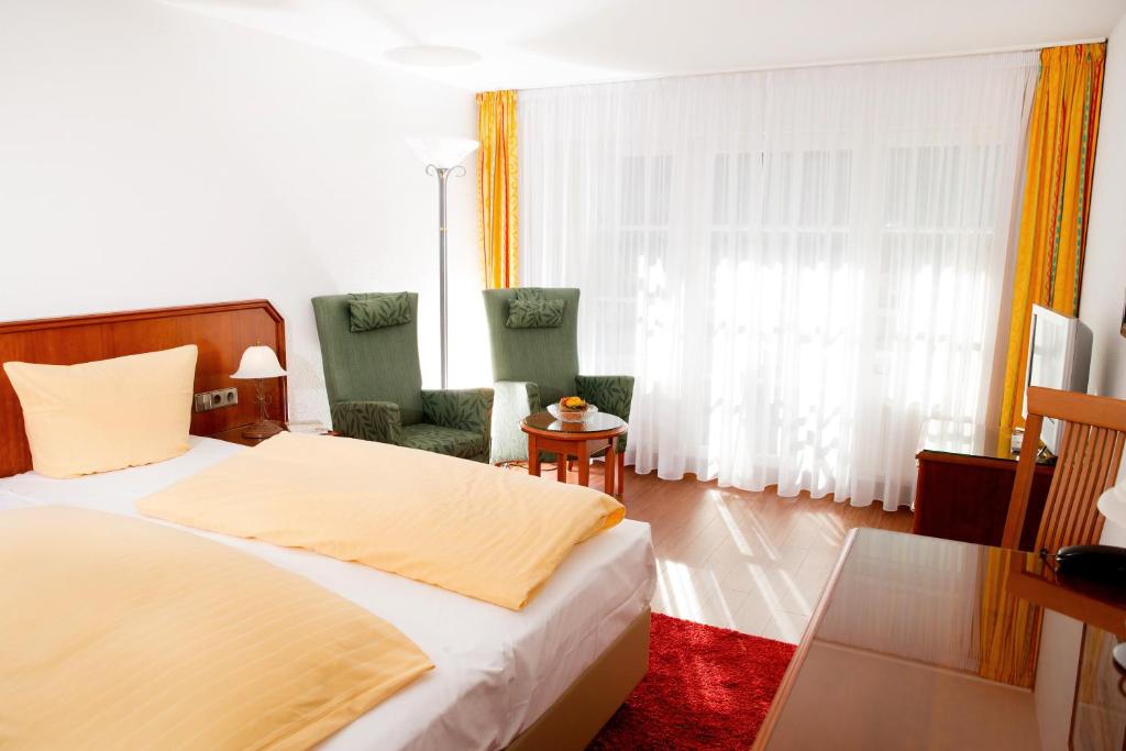 Postel nebo postele na pokoji v ubytování Hotel Seeperle