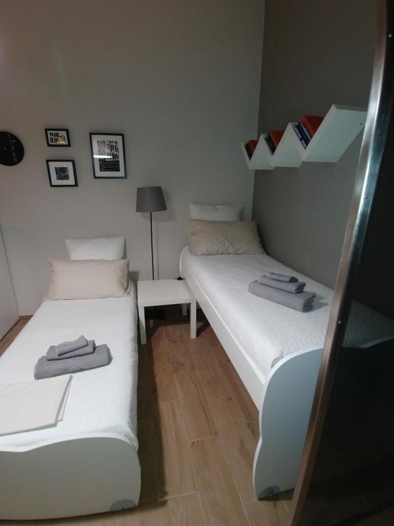 Postel nebo postele na pokoji v ubytování Diadumeno Superior Apartment