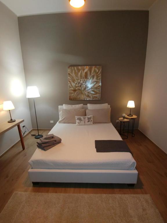 Postel nebo postele na pokoji v ubytování Diadumeno Superior Apartment