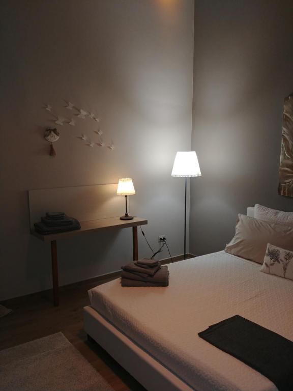 Postel nebo postele na pokoji v ubytování Diadumeno Superior Apartment