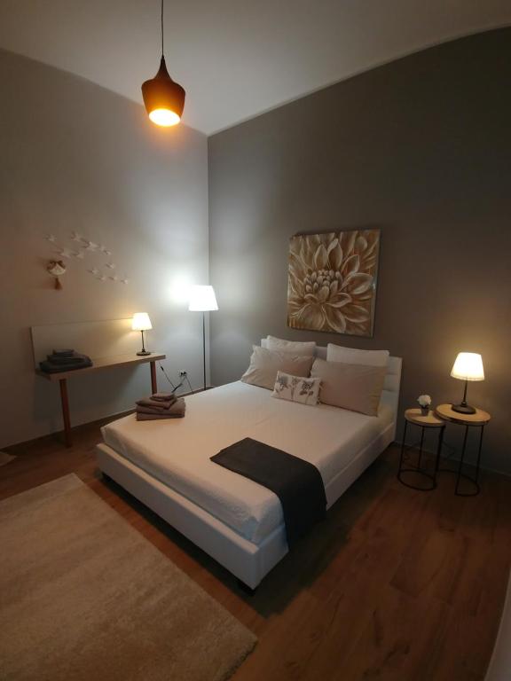 Postel nebo postele na pokoji v ubytování Diadumeno Superior Apartment