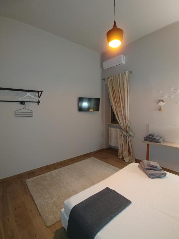 Postel nebo postele na pokoji v ubytování Diadumeno Superior Apartment