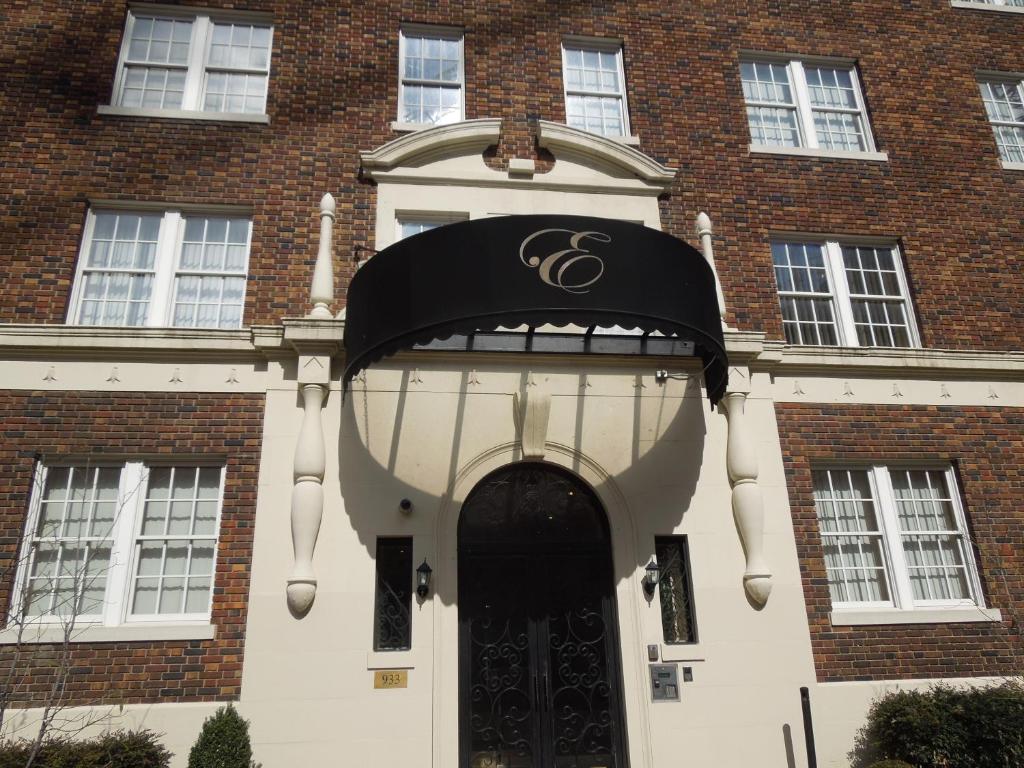 a large brick building with a door with a sign on it at The Eldon Luxury Suites in Washington