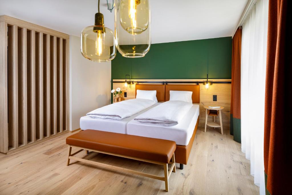 Ein Bett oder Betten in einem Zimmer der Unterkunft Hirschen Wildhaus