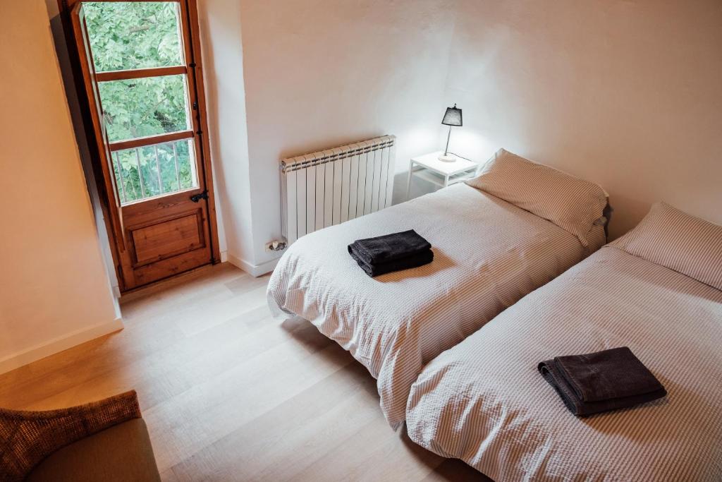 Postel nebo postele na pokoji v ubytování Villa Can Benet at Can Campolier