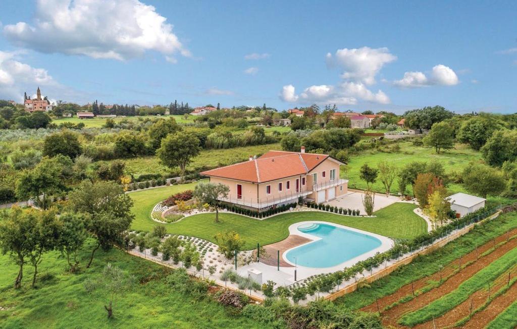 an aerial view of a house with a swimming pool at Villa Giò in Pula