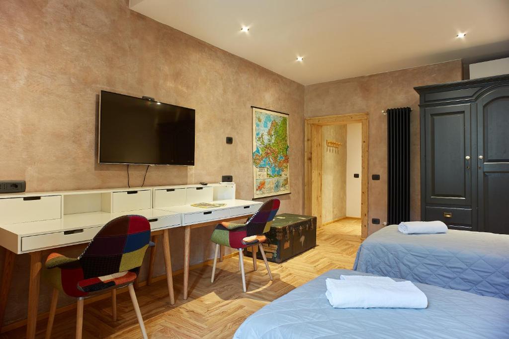 Łóżko lub łóżka w pokoju w obiekcie Casa Spinetta Malaspina - Verona Apartments