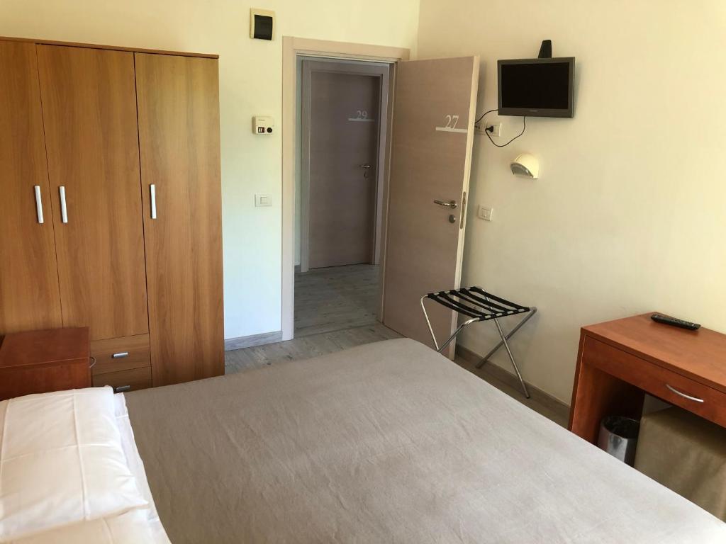 Postel nebo postele na pokoji v ubytování Hotel Lux