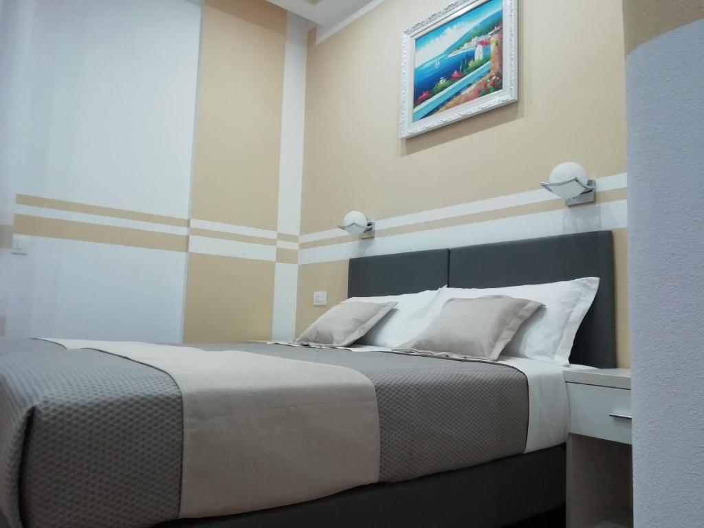 Łóżko lub łóżka w pokoju w obiekcie Affittacamere ELVI