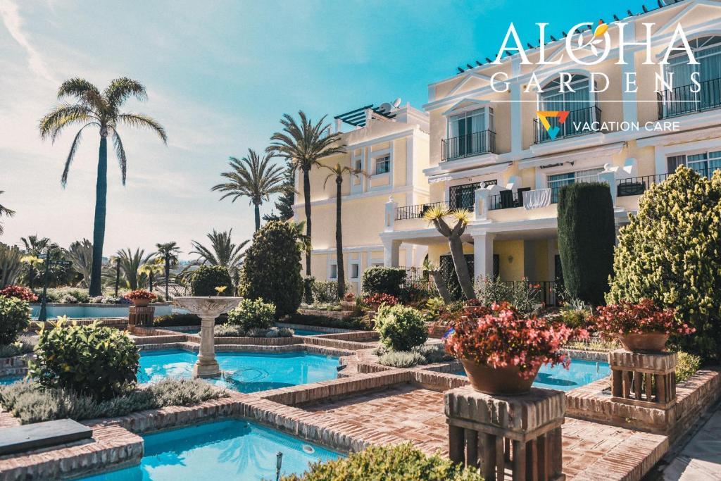 a hotel room with a large pool of water at Aloha Gardens by Vacation Care in Marbella