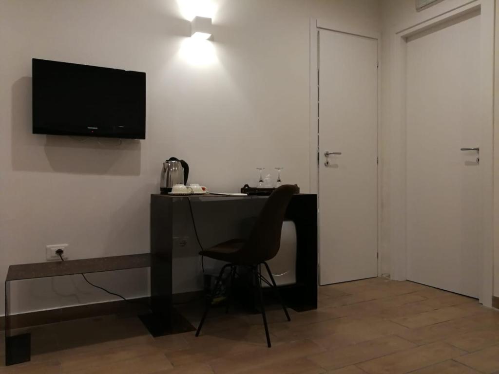 TV a/nebo společenská místnost v ubytování Hotel Assisivm Antica Dimora AD