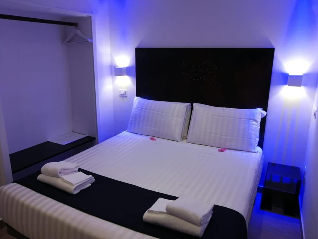 Postel nebo postele na pokoji v ubytování Hotel Assisivm Antica Dimora AD