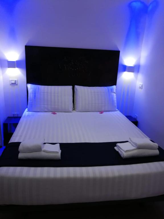 Postel nebo postele na pokoji v ubytování Hotel Assisivm Antica Dimora AD