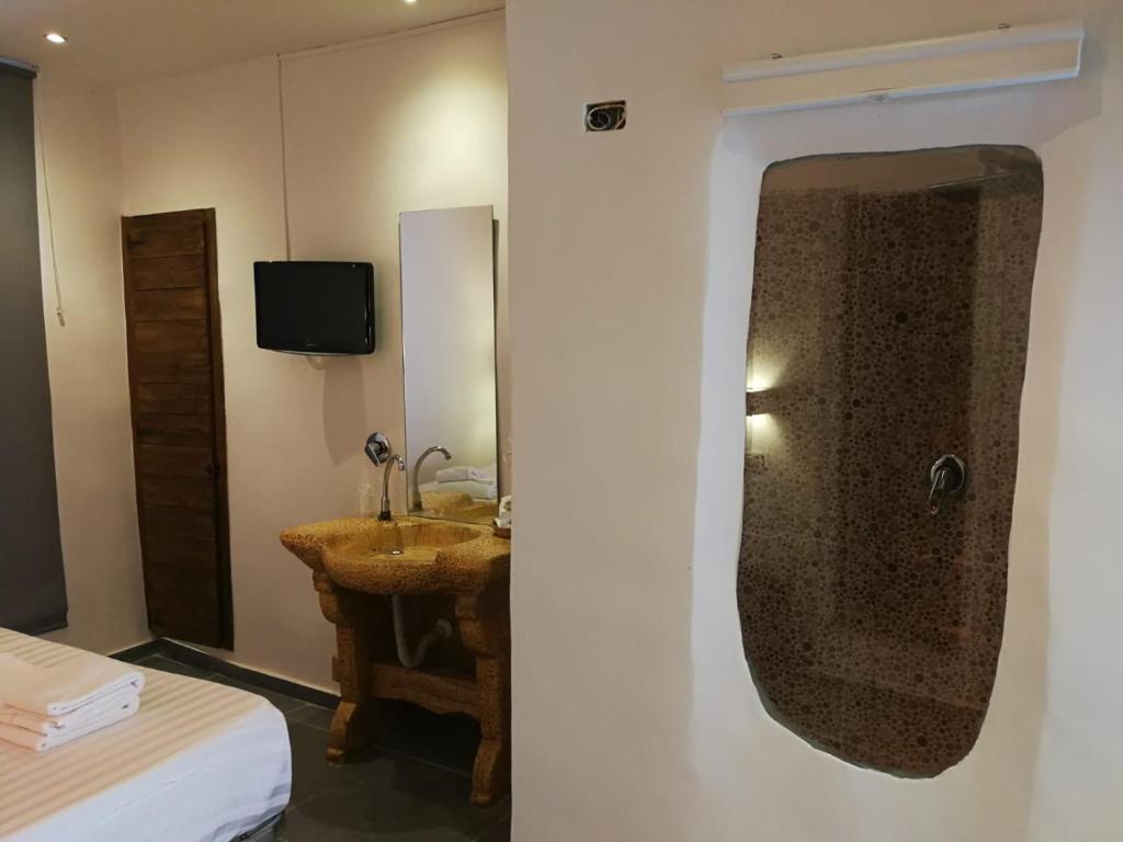 TV a/nebo společenská místnost v ubytování Hotel Assisivm Antica Dimora AD