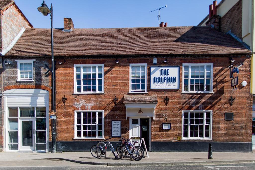a brick building with bikes parked outside of it at The Dolphin in Newbury