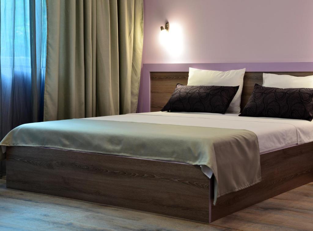 Postel nebo postele na pokoji v ubytování Visito Aparthouse