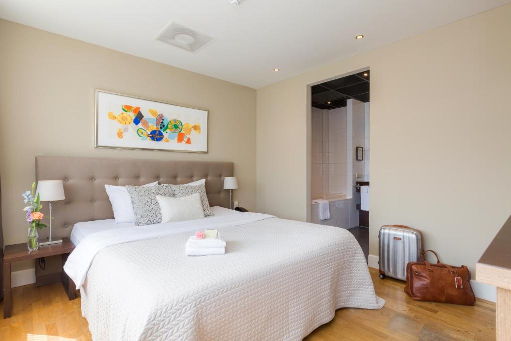 Postel nebo postele na pokoji v ubytování Boutique Hotel Lumiere