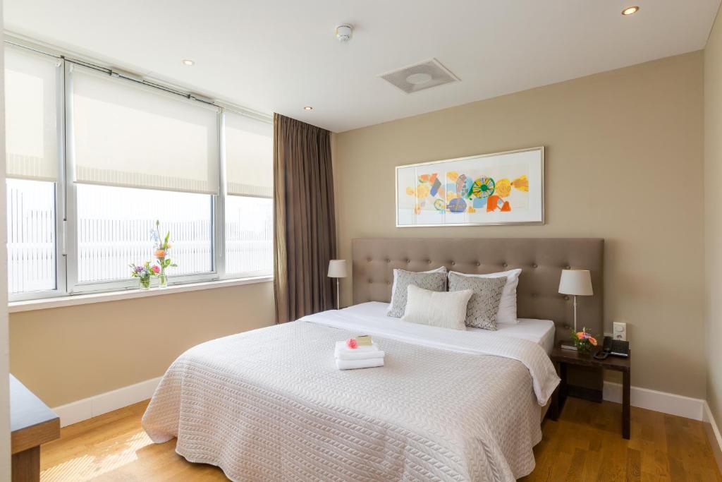 Postel nebo postele na pokoji v ubytování Boutique Hotel Lumiere