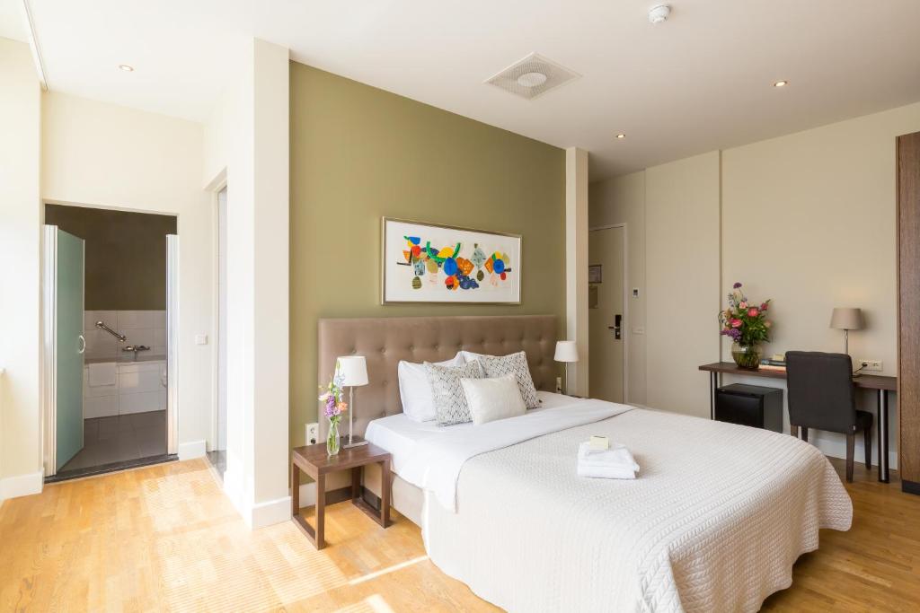 Postel nebo postele na pokoji v ubytování Boutique Hotel Lumiere