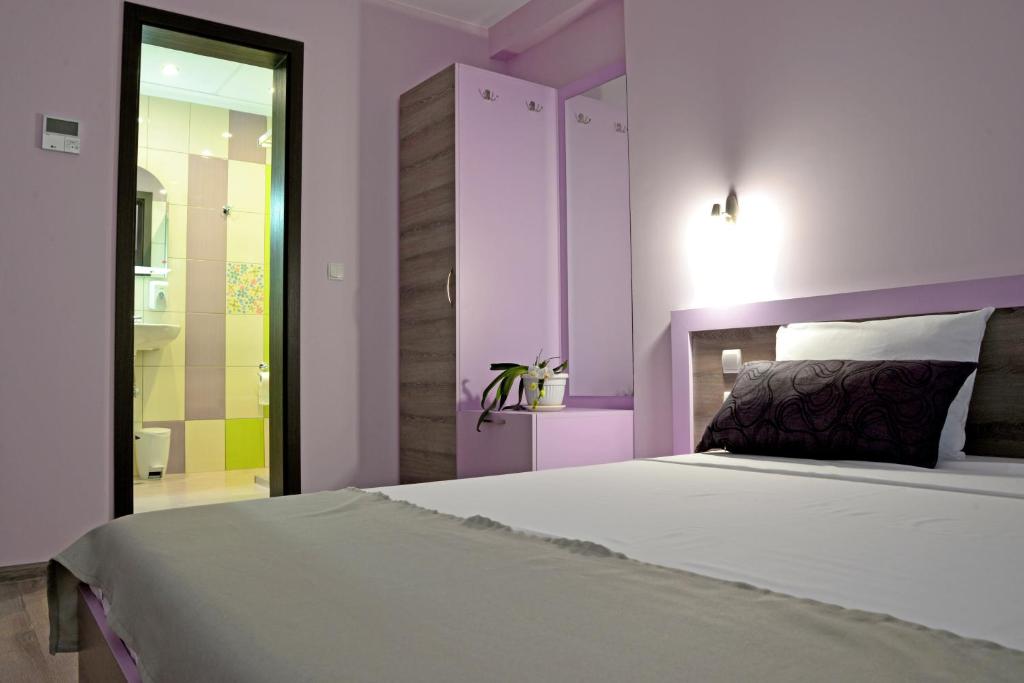 Postel nebo postele na pokoji v ubytování Visito Aparthouse