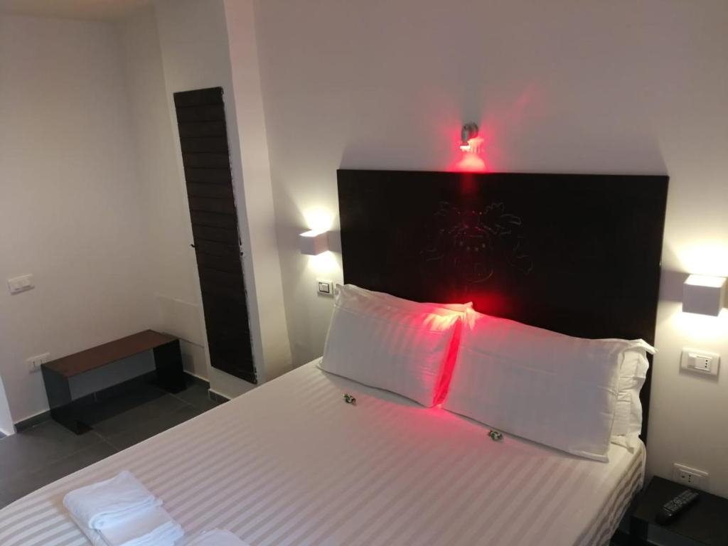 Postel nebo postele na pokoji v ubytování Hotel Assisivm Antica Dimora AD