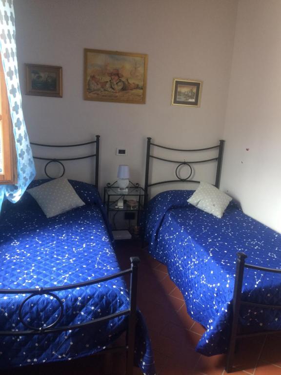 Postel nebo postele na pokoji v ubytování Casale Le Querciole