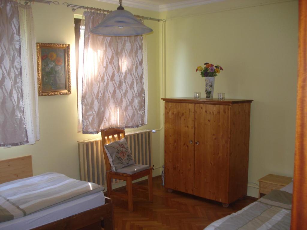 Posteľ alebo postele v izbe v ubytovaní Eszter Apartman
