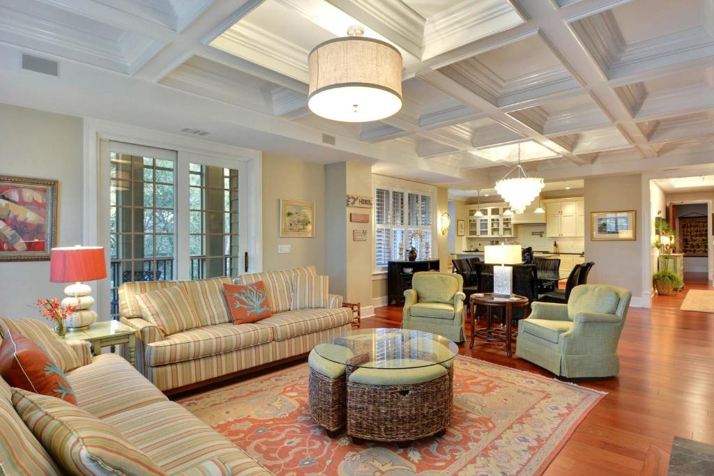 a living room with couches and chairs and a table at 6002 Maritime Villa in Kiawah Island