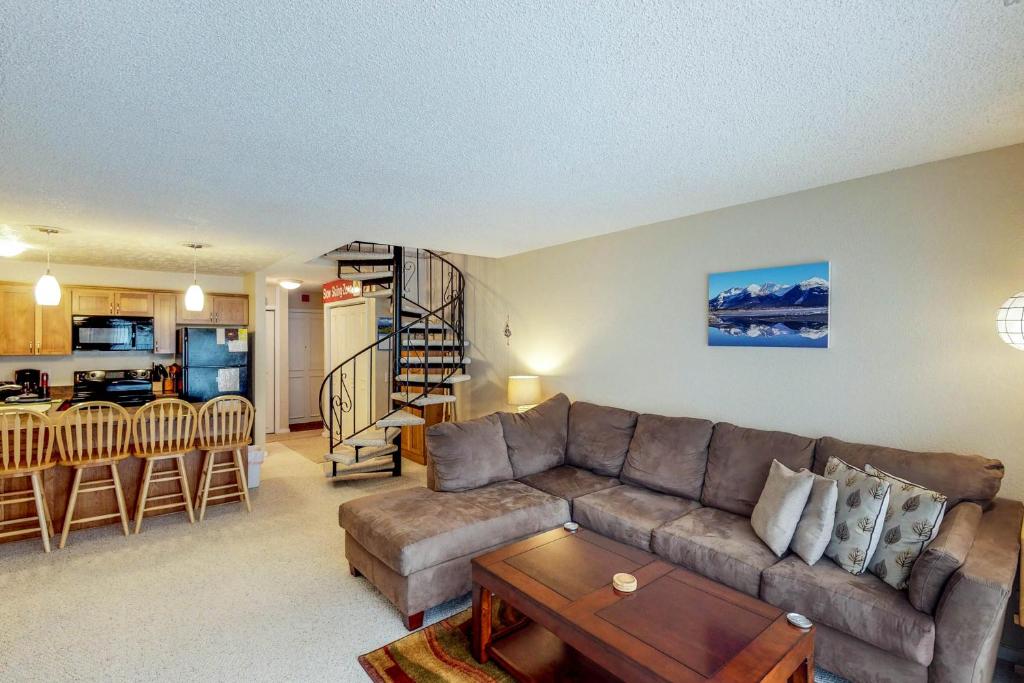 a living room with a couch and a table at Brighton Condo #209 in Girdwood