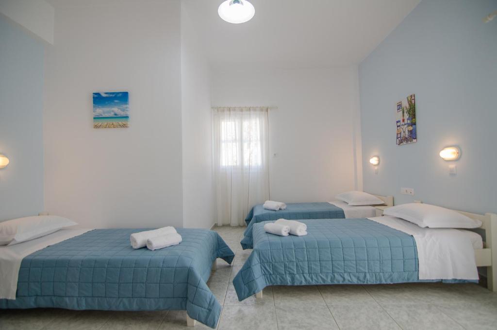 Athena Rooms客房内的一张或多张床位
