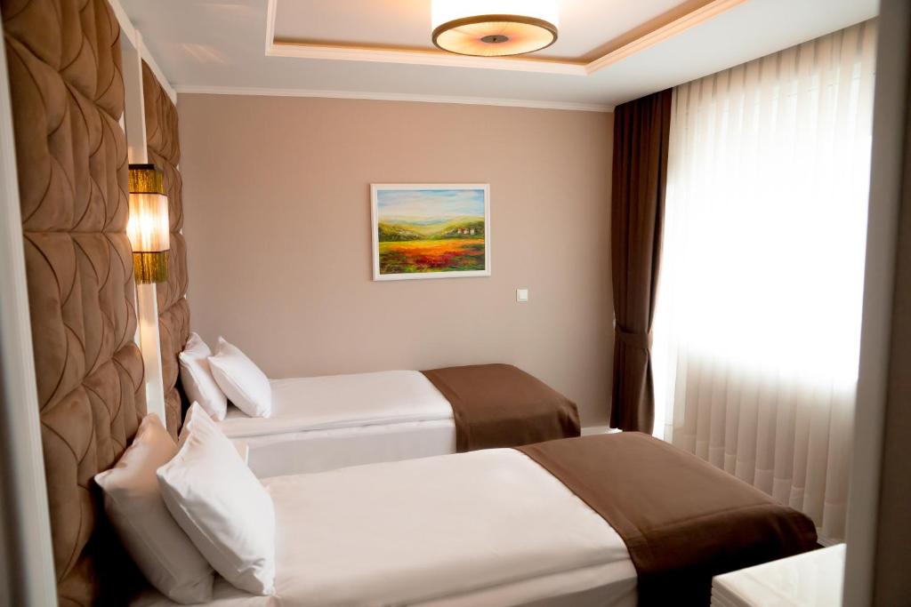 Postel nebo postele na pokoji v ubytování Hotel Arpezos