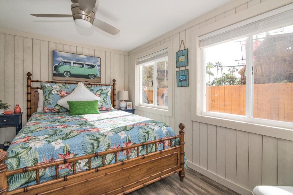 A bed or beds in a room at Serenity By The Sea Cottage A