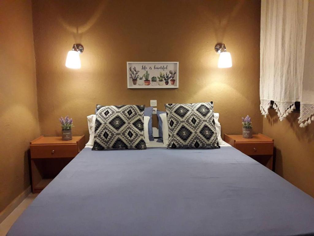 Postel nebo postele na pokoji v ubytování Stergiou Rooms
