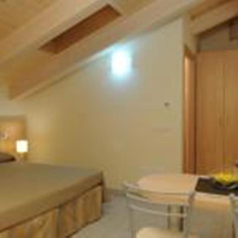 A bed or beds in a room at Residence Belmare