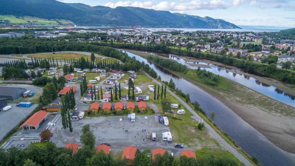an aerial view of a town next to a river at Orkla Camping in Orkanger