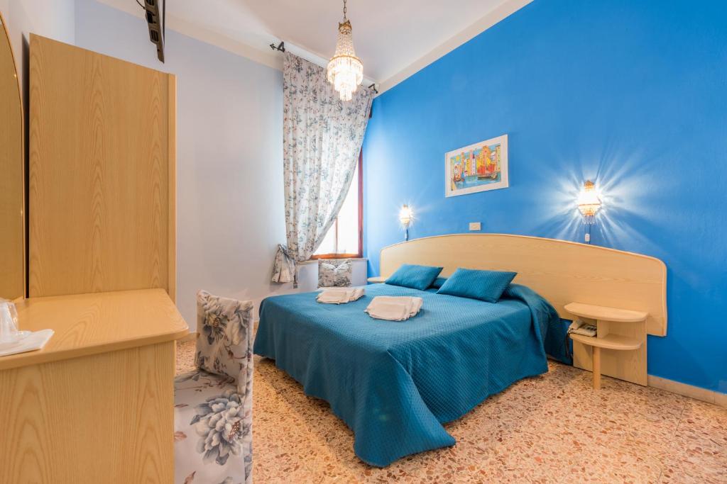 Postel nebo postele na pokoji v ubytování Hotel Stefania