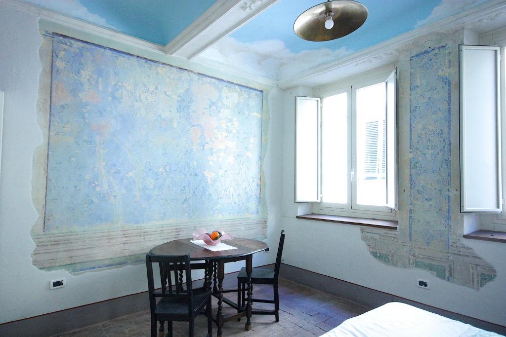 A bed or beds in a room at Il Giardino Apartment