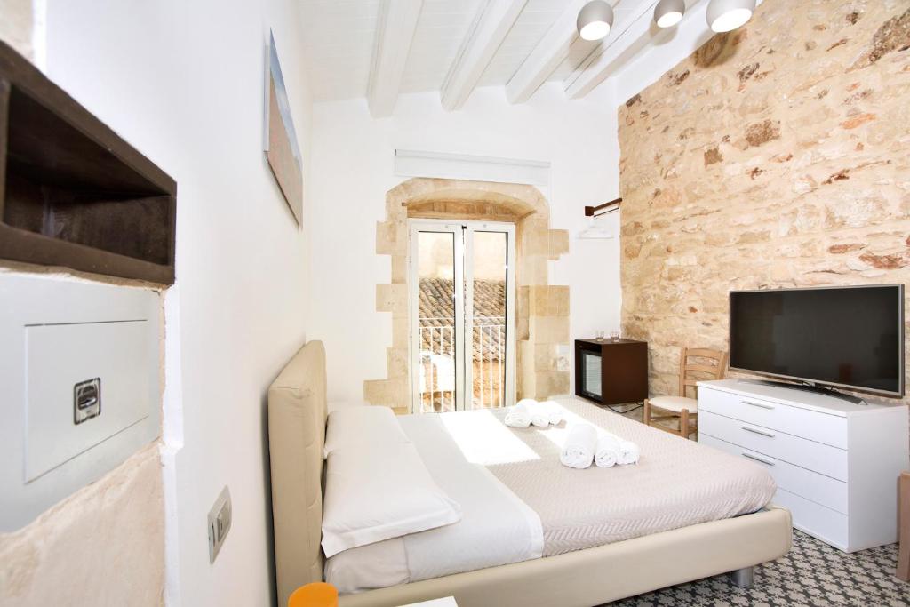 TV a/nebo společenská místnost v ubytování B&B Bianco E Blu