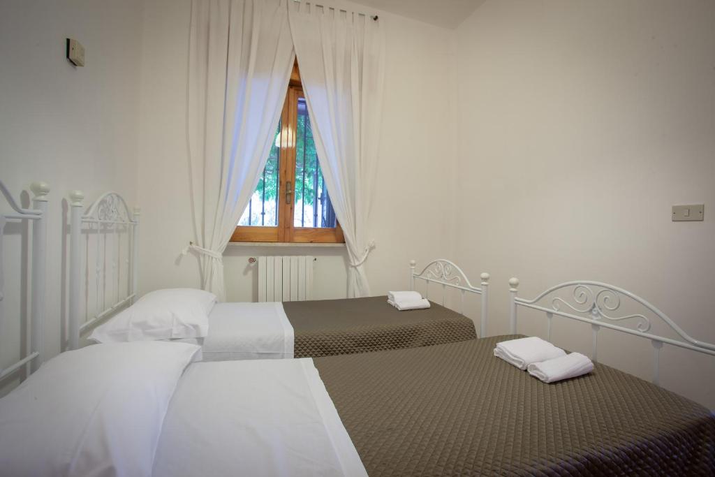 Postel nebo postele na pokoji v ubytování B&B Brunone