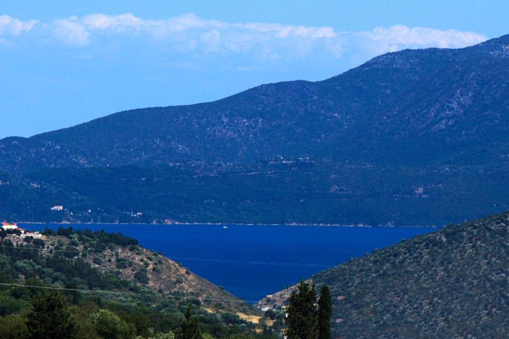 a view of a lake in the mountains at Minas Apartments in Divarata