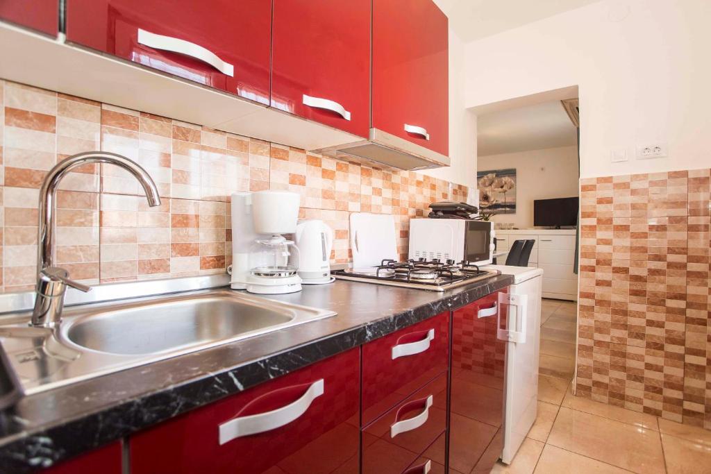 Kuchyň nebo kuchyňský kout v ubytování Apartman Barbara