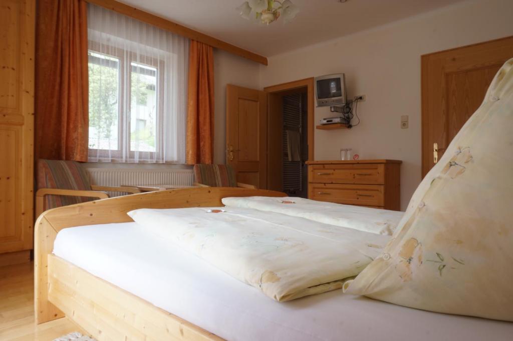 Postel nebo postele na pokoji v ubytování Musikhof Lexer